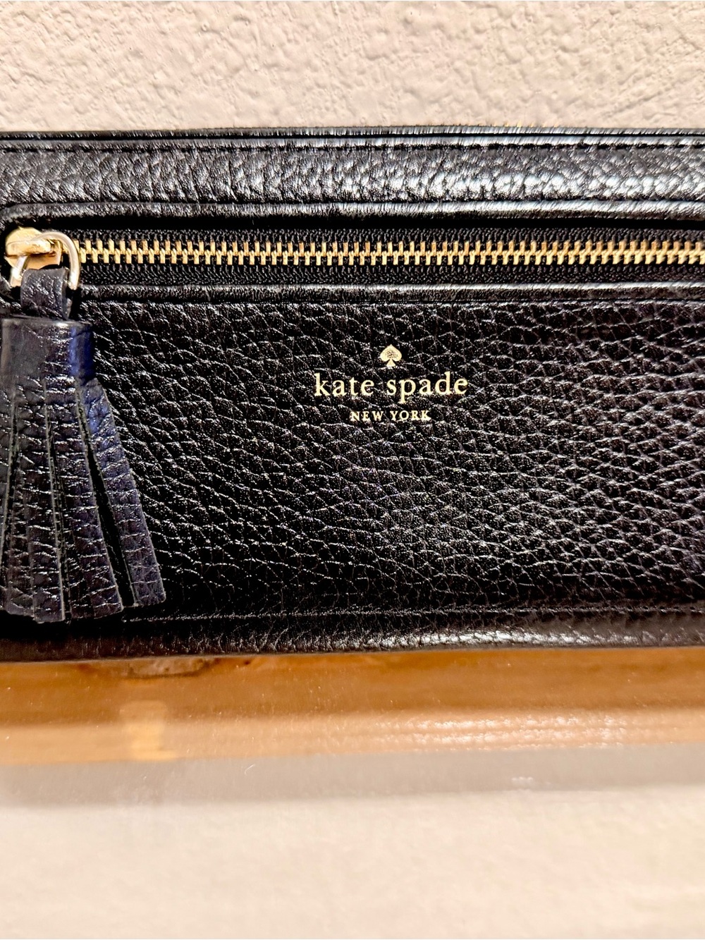 kate spade Black Pebbled Leather Zip Wallet with Tassel and Gold Logo